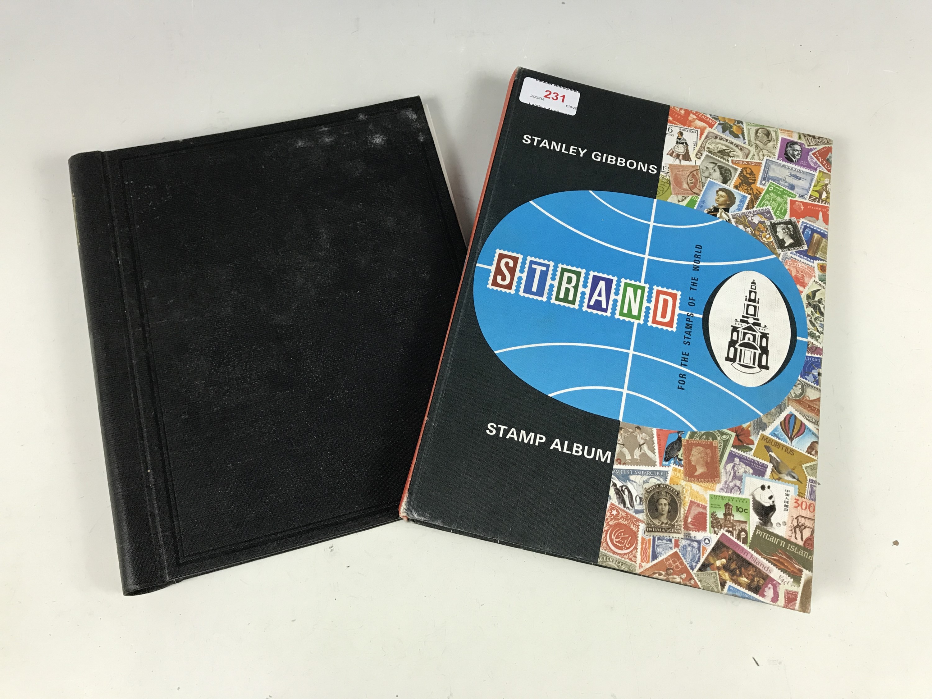 A Stanley Gibbons stamp album together with one other and stamps