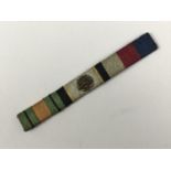 A Second World War whipped silk cord medal ribbon bar, including that of the Air Crew Europe star,