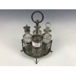 A Victorian cut glass and electroplate condiment set