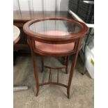 A contemporary glazed and inlaid mahogany bijouterie table