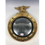 An old reproduction regency style gilt wood framed convex mirror