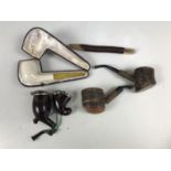 A cased Vienna meerschaum pipe together with others