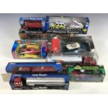 Various boxed racing cars together with a Giant dumper truck etc.