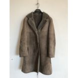 A lady's sheepskin coat retailed by Julian Vard, size 14, as new