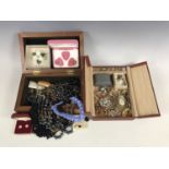 Two vintage jewellery boxes containing a quantity of assorted costume jewellery, including paste