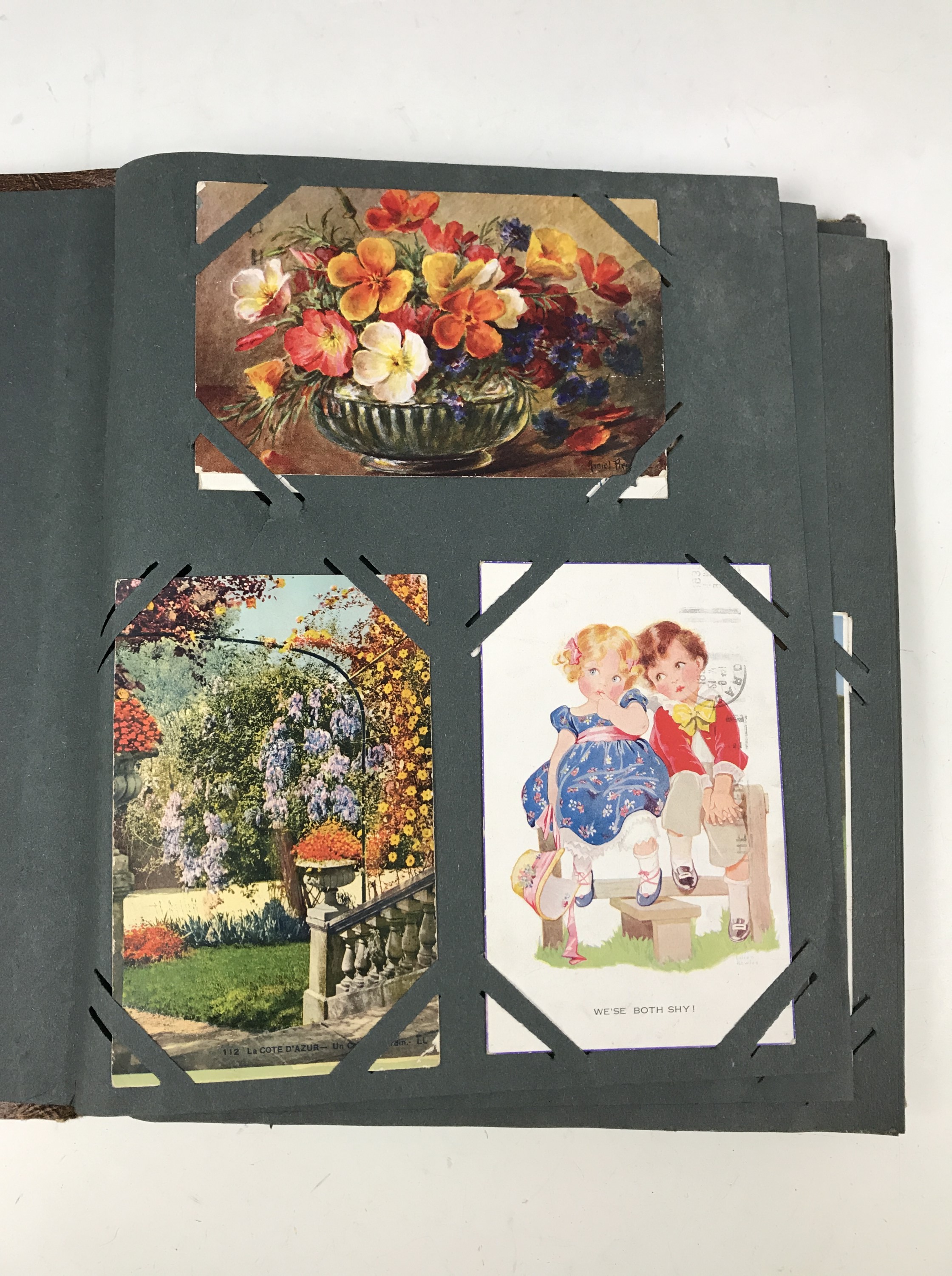 A postcard album containing Mabel Lucie Attwell and Margaret Tarrant postcards etc - Image 2 of 6