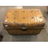 A domed tin trunk