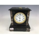 A Victorian polished black slate and marble mantel clock