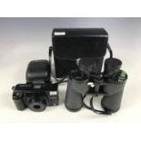 A Minolta AF-Zoom90 camera and a set of Swift Belmont De Luxe 10 x 50 binoculars