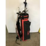 A lady's golf bag and stand together with clubs