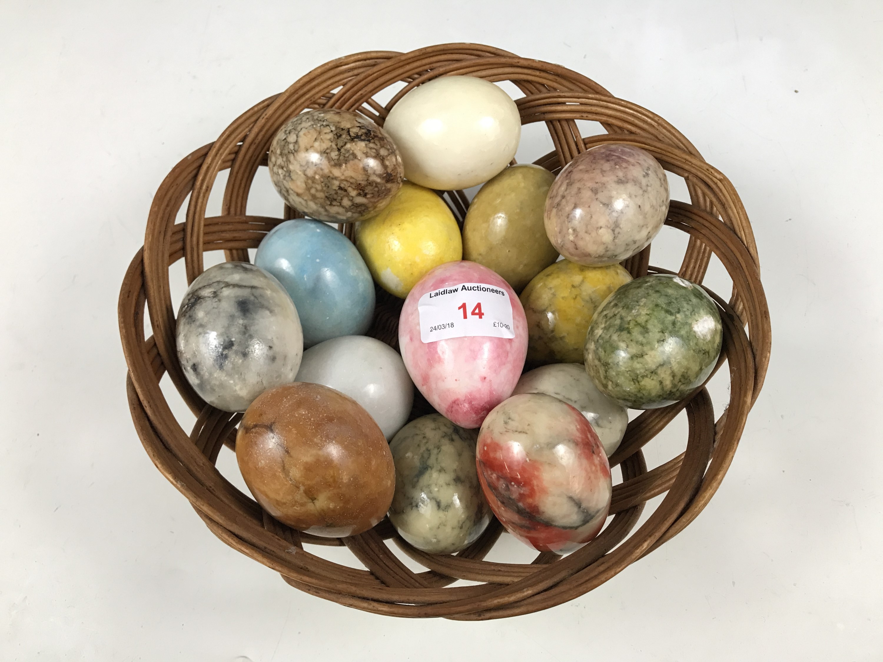 A wicker basket together with a quantity of onyx and other eggs