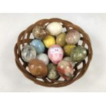 A wicker basket together with a quantity of onyx and other eggs