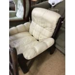 An Ekorness cream leather armchair