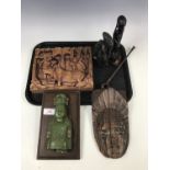 Sundry ethnographica including a wooden mask, a carved plaque and a pair of tribal figures etc