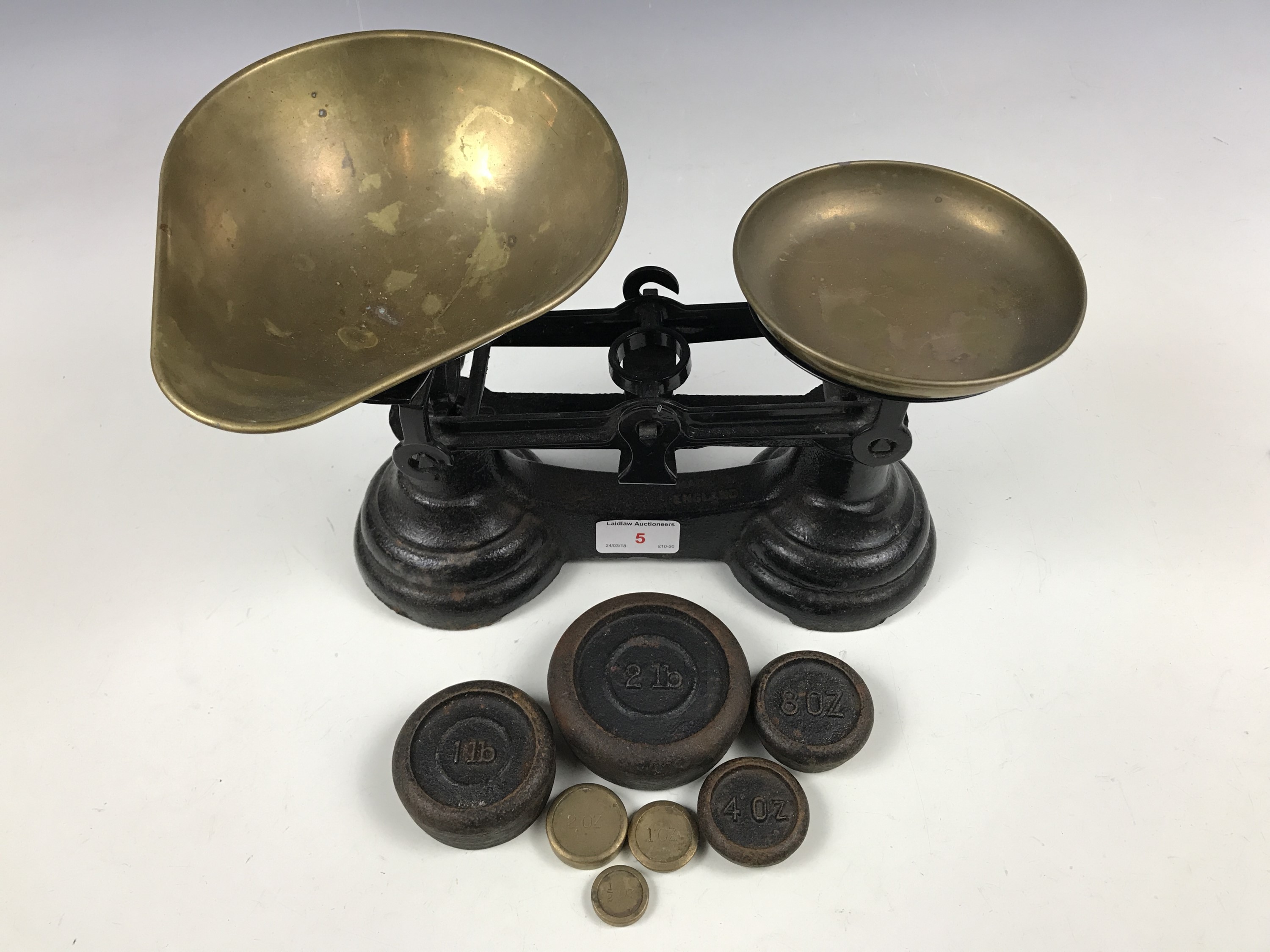 A vintage set of kitchen scales and weights