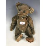 An early 20th Century blonde mohair Teddy bear, having elongated snout and paws, and black 'boot