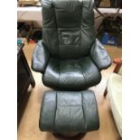 An Ekorness leather recliner chair and footstool