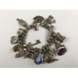 A silver charm bracelet, 81 g