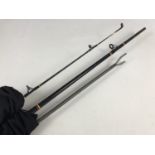 A Shakespeare Ugly Stick 8'6 two-piece carbon spinning rod