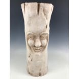 A modern papier-mache sculpture modelled as a carved tree stump, 60 cm high