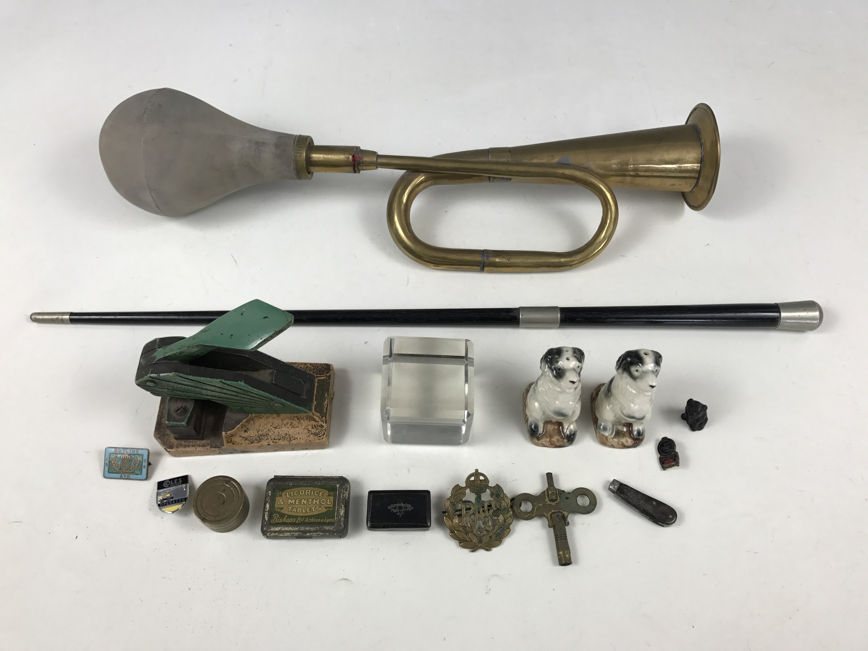 Sundry collectors' items including a conductor's baton, Butlins and other badges and a 19th