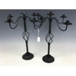 A pair of cast-metal candelabra