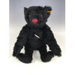 A Steiff Titanic 1912 replica Classic growling bear, with black mohair and red felt rimmed eyes,