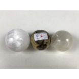 Three polished mineral spheres