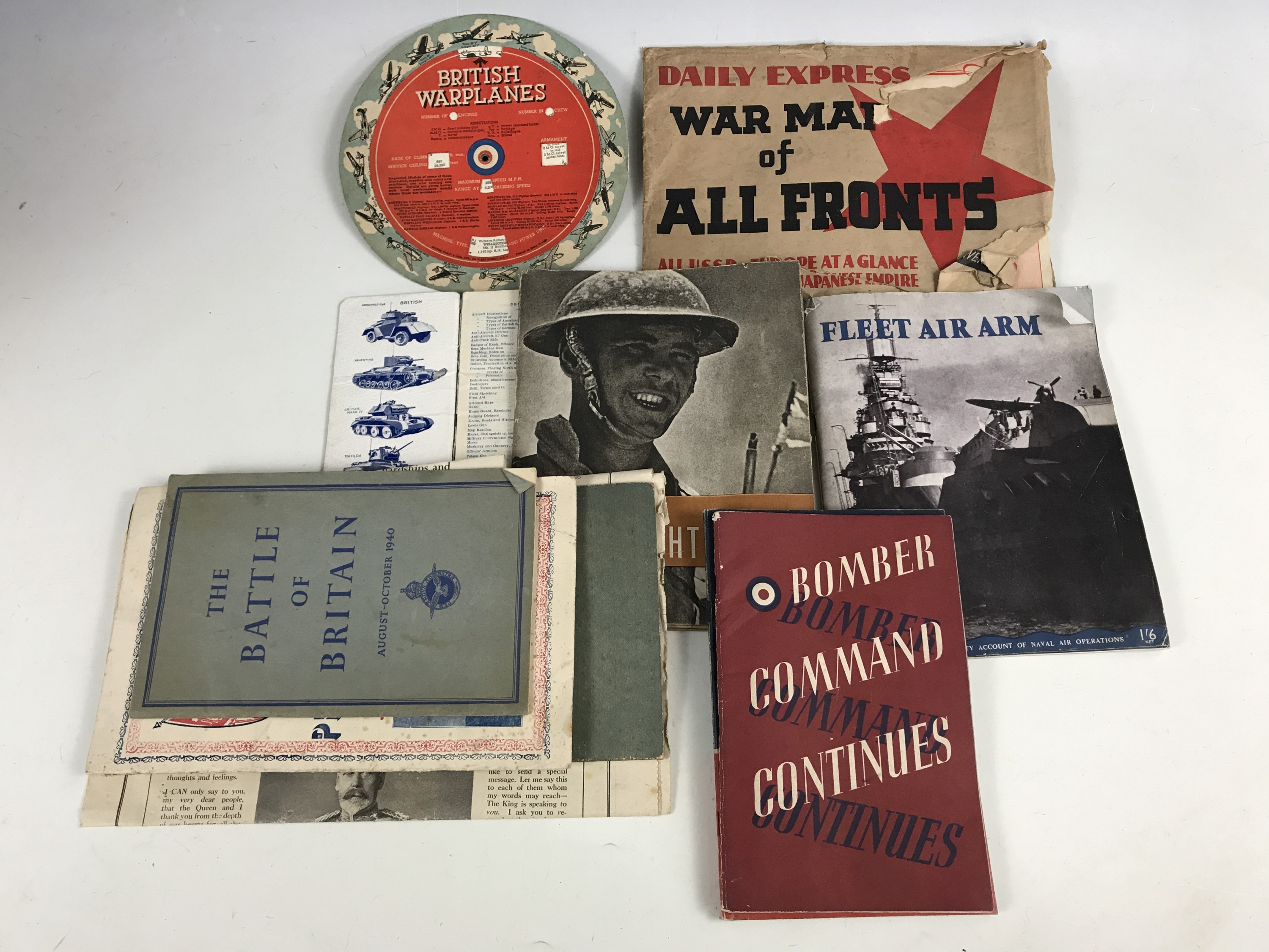 Ephemera including enemy and British warplane identification wheels, and a Daily Express War map