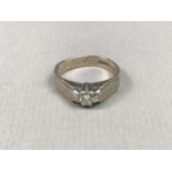 An 18ct white gold diamond solitaire ring, the brilliant-cut stone of approximately .25ct, claw