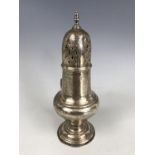 An Edwardian silver caster, of baluster form, Robert Pringle and Sons, London, 1907, 112.5g