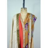 A mid 20th Century Zoroastrian Parsi sari in a printed floral design over a bronze ground, trimmed