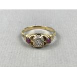 A late 19th / early 20th Century diamond and ruby dress ring, the old-cut diamonds sunken set to the