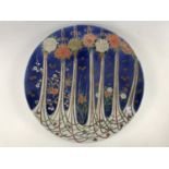 A late Meiji / Taisho Japanese plaque / charger, decorated depicting floral kites / medallions