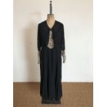 An early 20th Century lady's black chiffon and cream tambour lace dress, having V neckline and