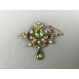 A Belle Epoch peridot, pearl and high carat yellow-metal brooch, of openwork form, having