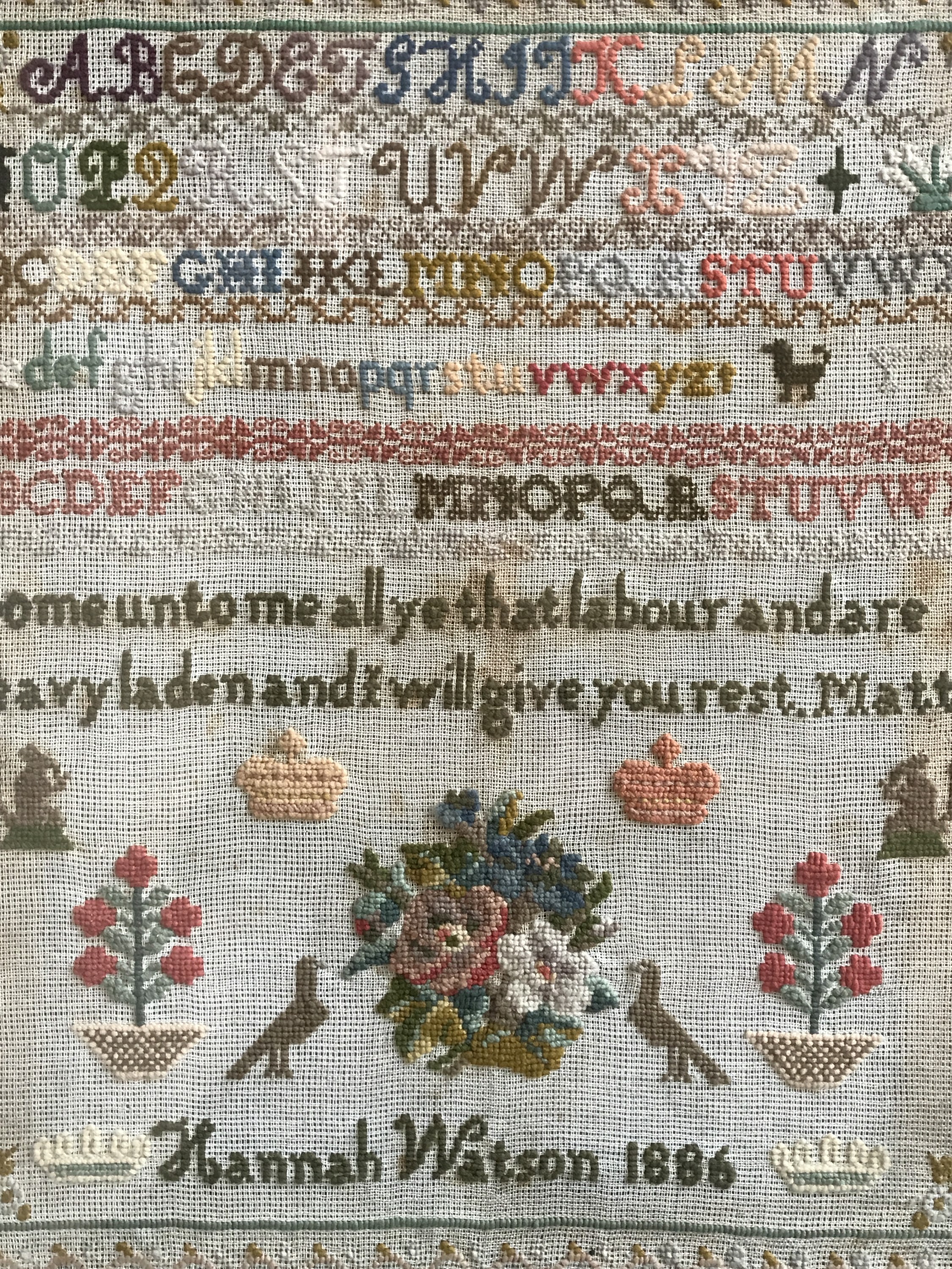 A Victorian needlework sampler worked by Hannah Watson in 1886, wool threads over aida, - Image 2 of 2