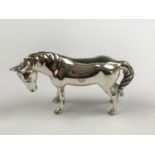 A contemporary white-metal novelty horse, tests as silver, 3.5 cm high, 24.4g