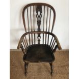 A Victorian Windsor arm chair, 108 cm high