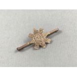 An early 20th Century Black Watch sweetheart brooch, stamped 9 ct, tests as gold, 2.3 g