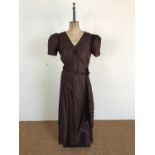 A 1930s chocolate-brown synthetic tumbling-leaf self-patterned evening dress, having a V-neck,