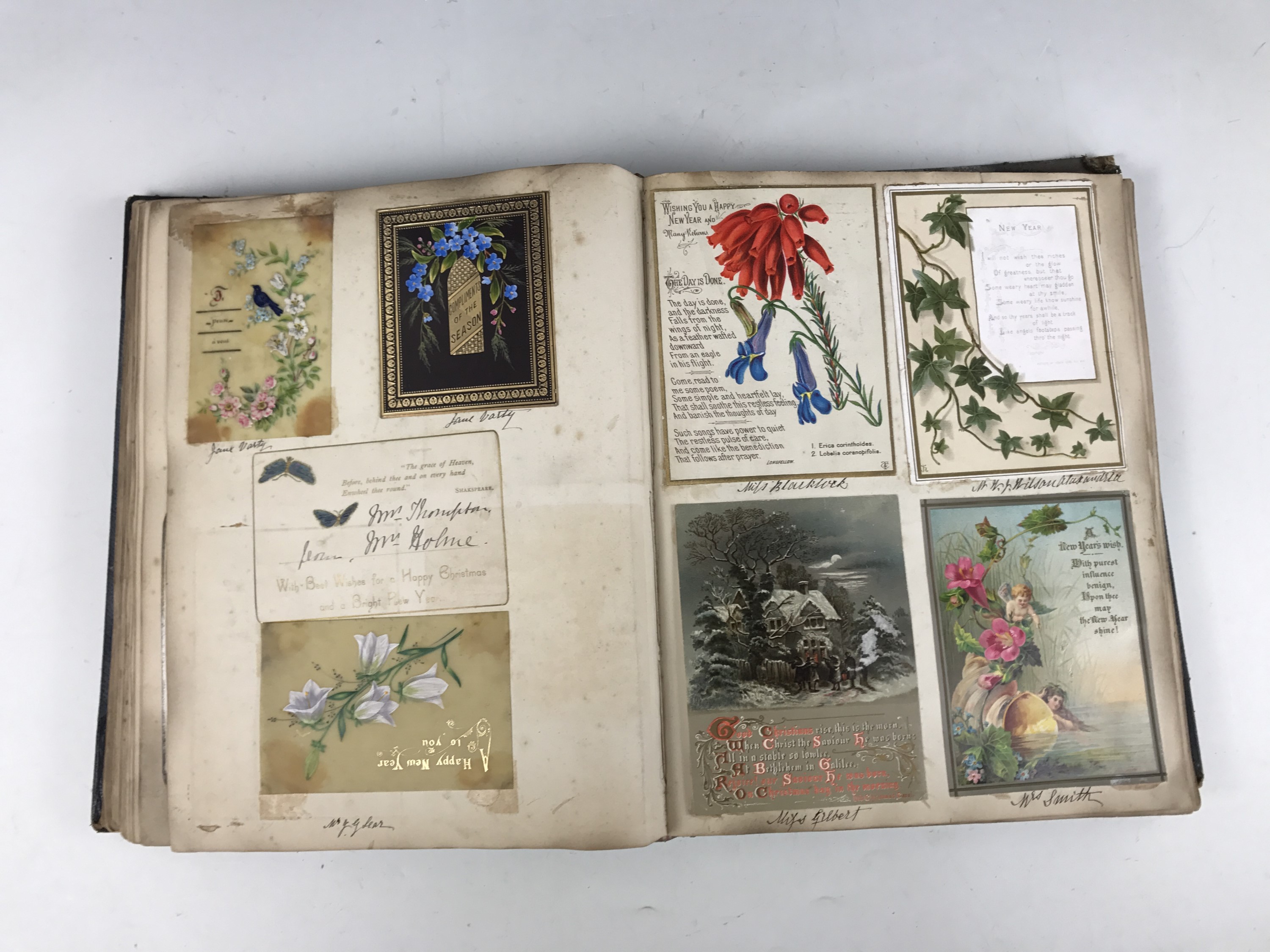 A late Victorian scrap album containing a collection of tipped-in Christmas cards, each with pen and - Image 5 of 5