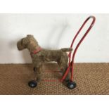 A Lines Brothers (Ireland) Ltd child's push along walker modelled as a fox terrier, mid-20th