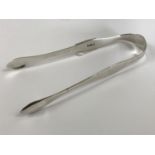 A pair of Georgian silver sugar tongs, Peter and William Bateman, London, 1809, 33g