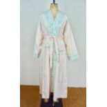 A 20th Century Zoroastrian Parsi house coat of pink cotton having a mint green kha-kha stitched