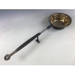 An 18th Century wrought-iron and brass "down-hearth" skillet, 70 cm long