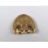A Japanese ivory netsuke modelled as a bat, bearing inset mother-of-pearl plaque and signature,
