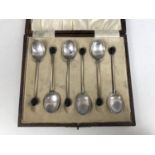 A cased set of six George V silver coffee spoons, having coffee bean terminals, Birmingham, 1929,