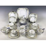 A Shelley Balloon Tree pattern Queen Anne part tea and coffee set, comprising eight tea cups and