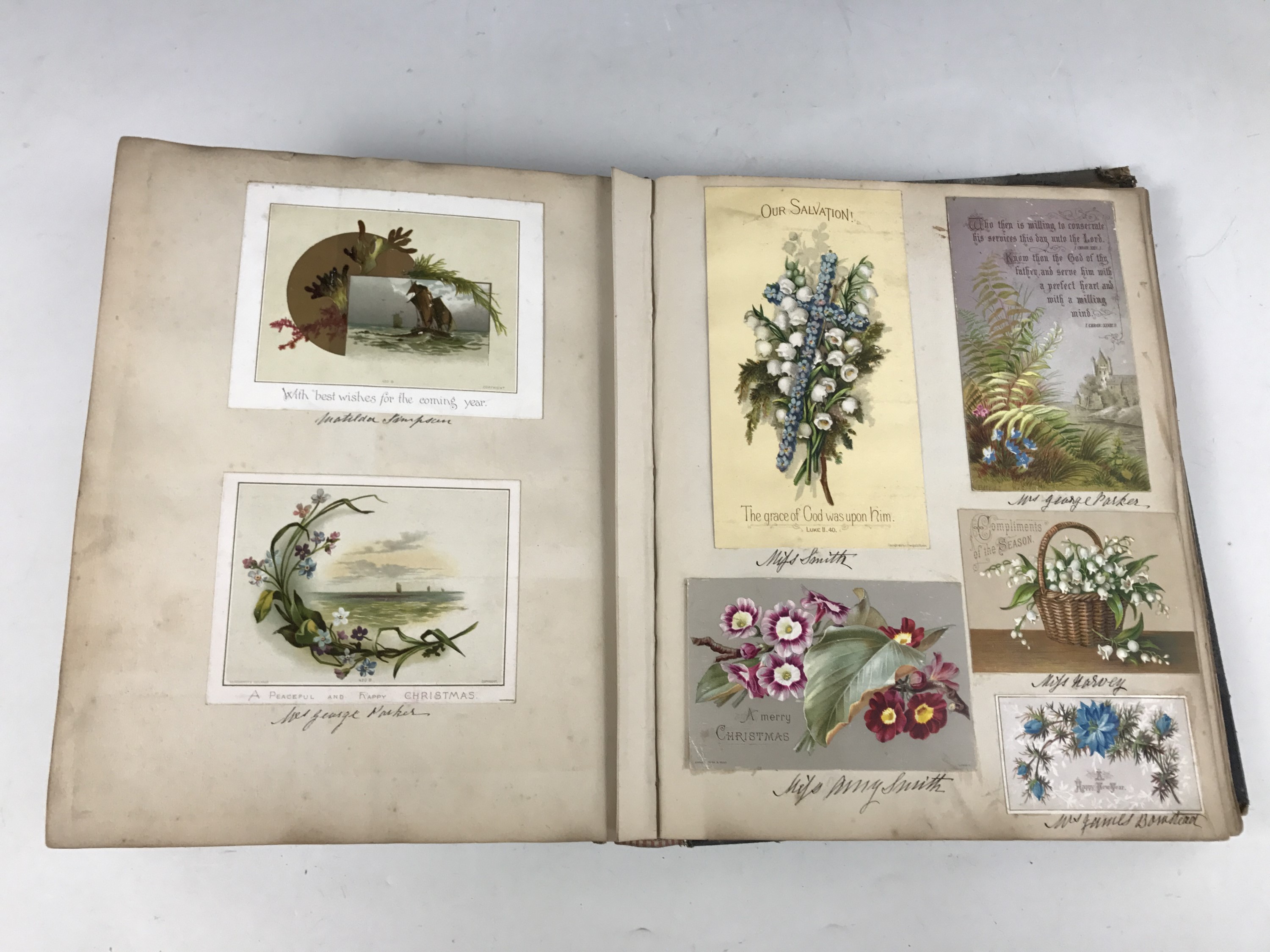 A late Victorian scrap album containing a collection of tipped-in Christmas cards, each with pen and - Image 4 of 5